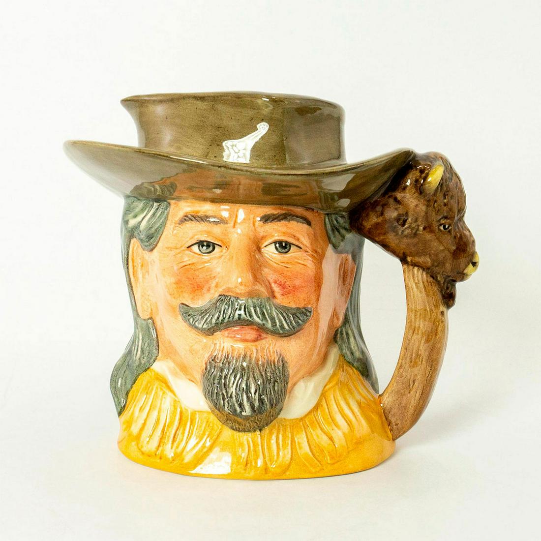 Buffalo Bill D6735 - Odd Size - Royal Doulton Character: Series: The Wild West Collection, issued 1985 - 1989. Light brown hat and buckskin jacket. Doulton backstamp. Royal Doulton Character Jug, Buffalo Bill D6735. William Frederick Cody (1846 - 1917) was