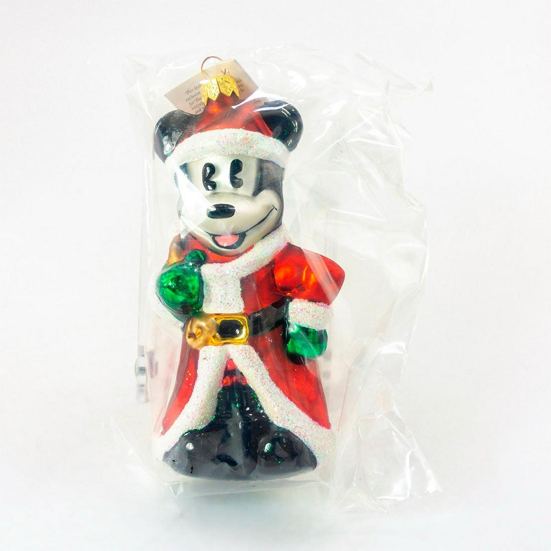 Christopher Radko Christmas Ornament, Christmas Eve: Produced exclusively for A Disney Catalog. Colorful hand-painted glass ornament of Mickey Mouse in Santa Claus costume. Comes with original box. Includes original tag. Comes in original plastic packin