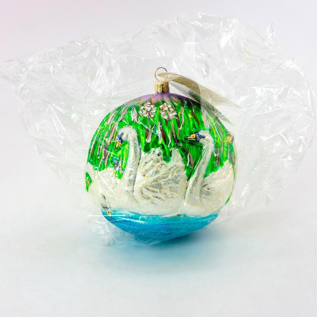 Christopher Radko Christmas Ornament, Seven Swans A: Limited edition 1909 of 10,000. The 12 days of Christmas series. Lovely hand-painted glass ornament of seven swans swimming in lake. Glitter accent. Comes with original box. Includes original tag. Sea
