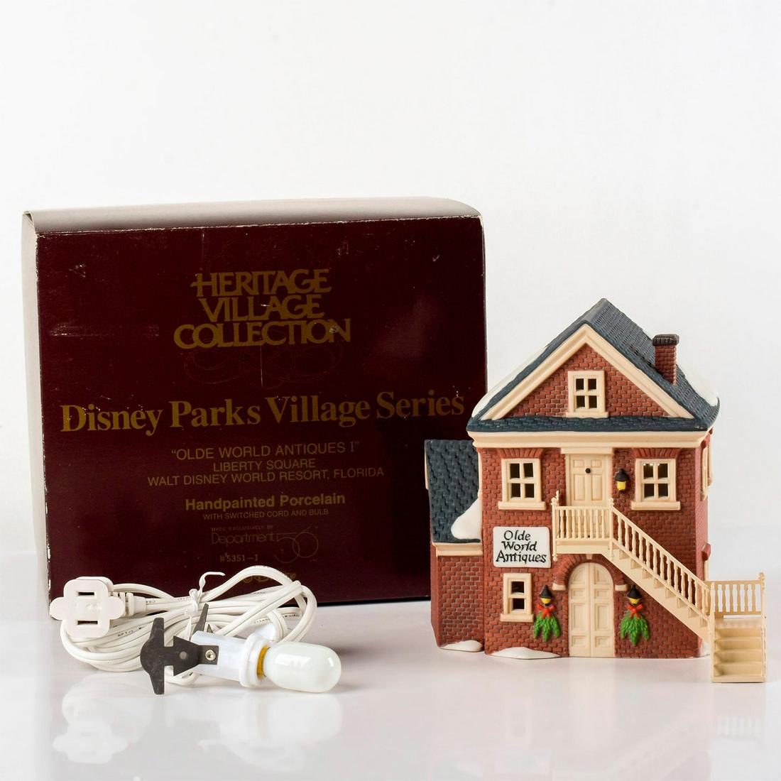 Department 56 Lighted Figure, Olde World Antiques I: Hand painted porcelain. Disney Parks Village series. Comes with switched cord and bulb. With original box. Department 56 backstamp. "The Heritage Village Collection" series. Figure measurements (wides