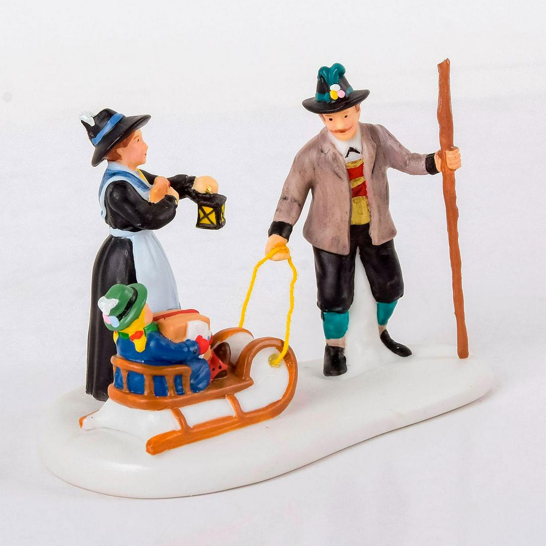 Department 56 Figurine, Alpine Village, Alpine: Mother, Father with lantern and child on a sled. Brown and blue colorations. Department 56 impressed on the bottom. With original box. #department56 #alpinevillage #christmas Issued: 2008-2010 Dimensi