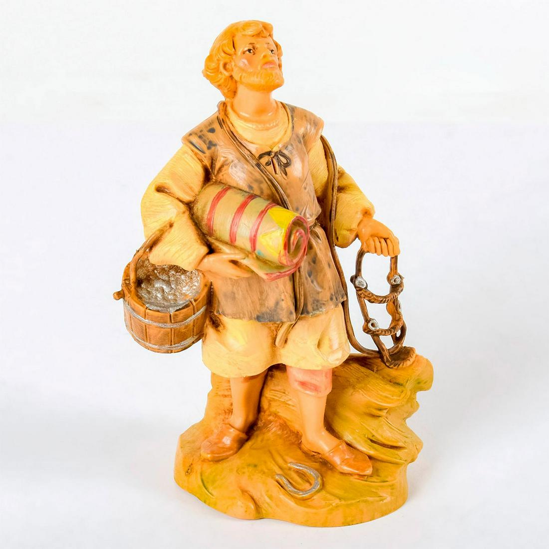 Roman Fontanini Figurine, Esau 75520: Heirloom Nativity series, hand painted. Young stable hand carrying a bridle, bucket, and saddle. Artist signature engraved on back. With original box. Fontanini backstamp. Good condition. #roman #font