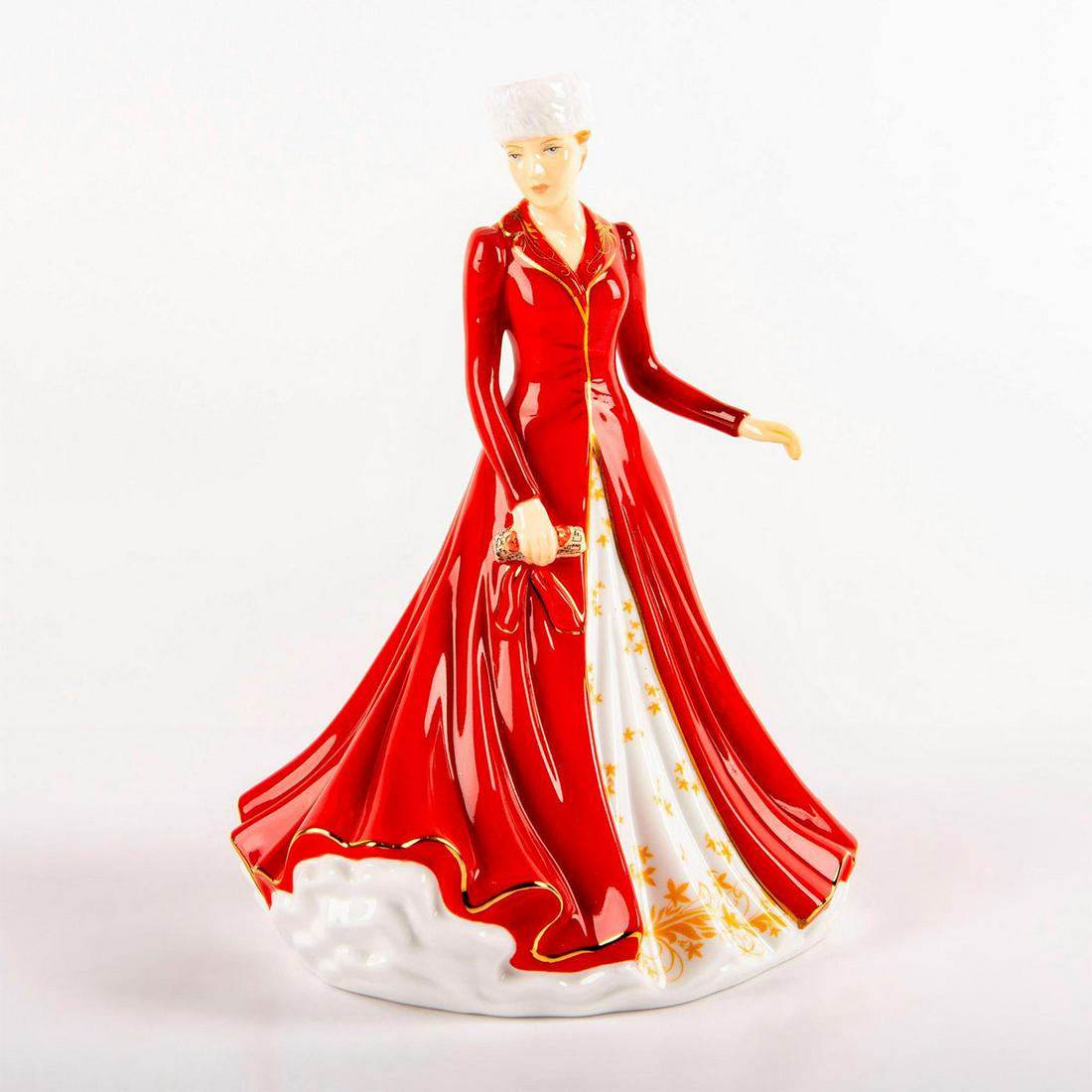 Hallelujah Chorus HN5758 - Royal Doulton Figurine: Bone China. She wears a long red overcoat with gold accents, over a white dress with yellow patterning. Artist: Neil Faulkner Issued: 2015 Dimensions: 7"H Manufacturer: Royal Doulton Country of Origin