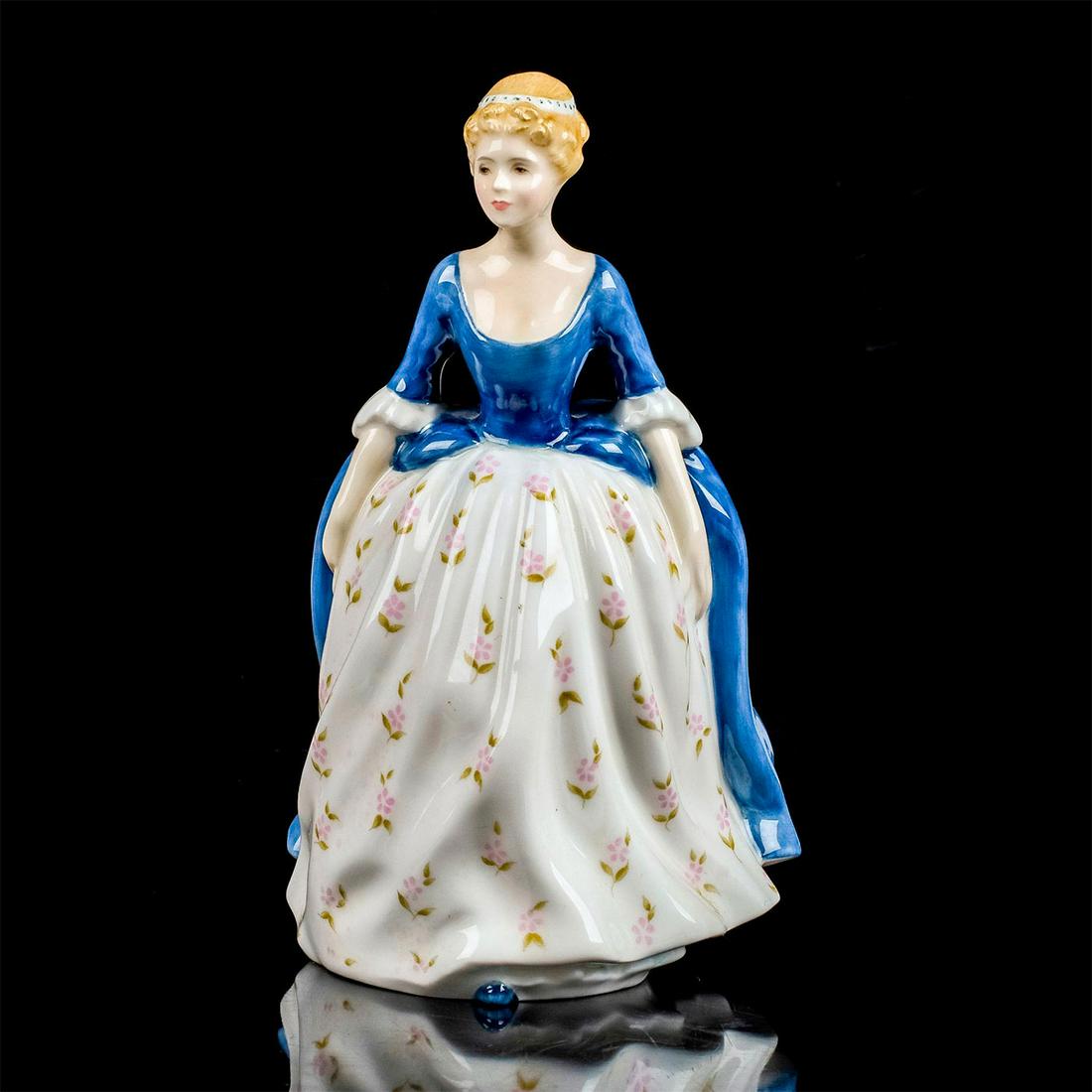 Alison HN2336 - Royal Doulton Figurine: Peggy Davies Classic series. Lady in dark blue and white dress with pink floral design. Royal Doulton backstamp. Artist: Peggy Davies Issued: 1966 - 1992 Dimensions: 7.5"H Manufacturer: Royal Doulton 