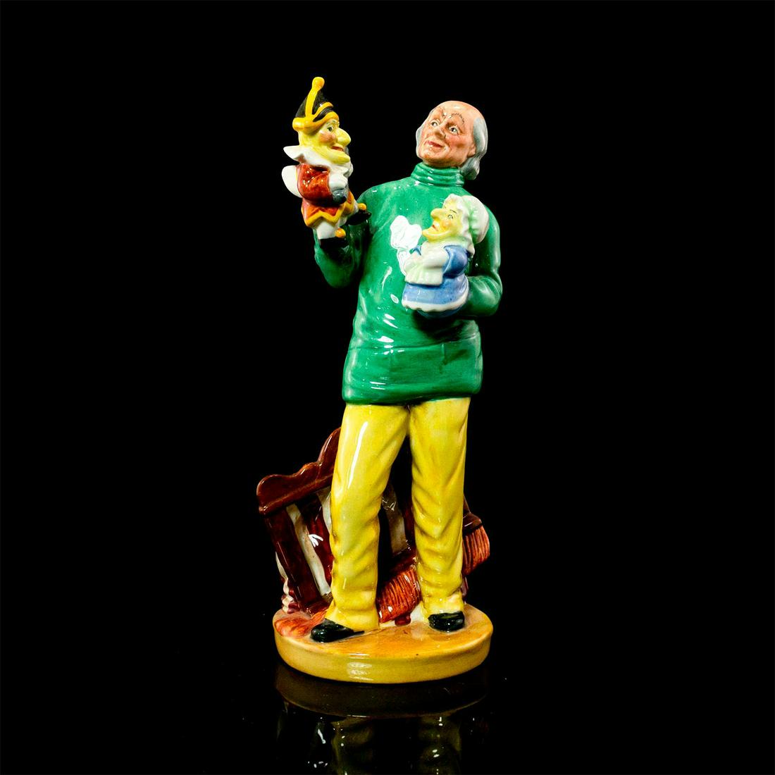 Punch and Judy Man HN2765 - Royal Doulton Figurine: Literary Characters series. Green and yellow coloration. Doulton backstamp. Artist: William K. Harper Issued: 1981-1990 Dimensions: 9"H Manufacturer: Royal Doulton Country of Origin: England