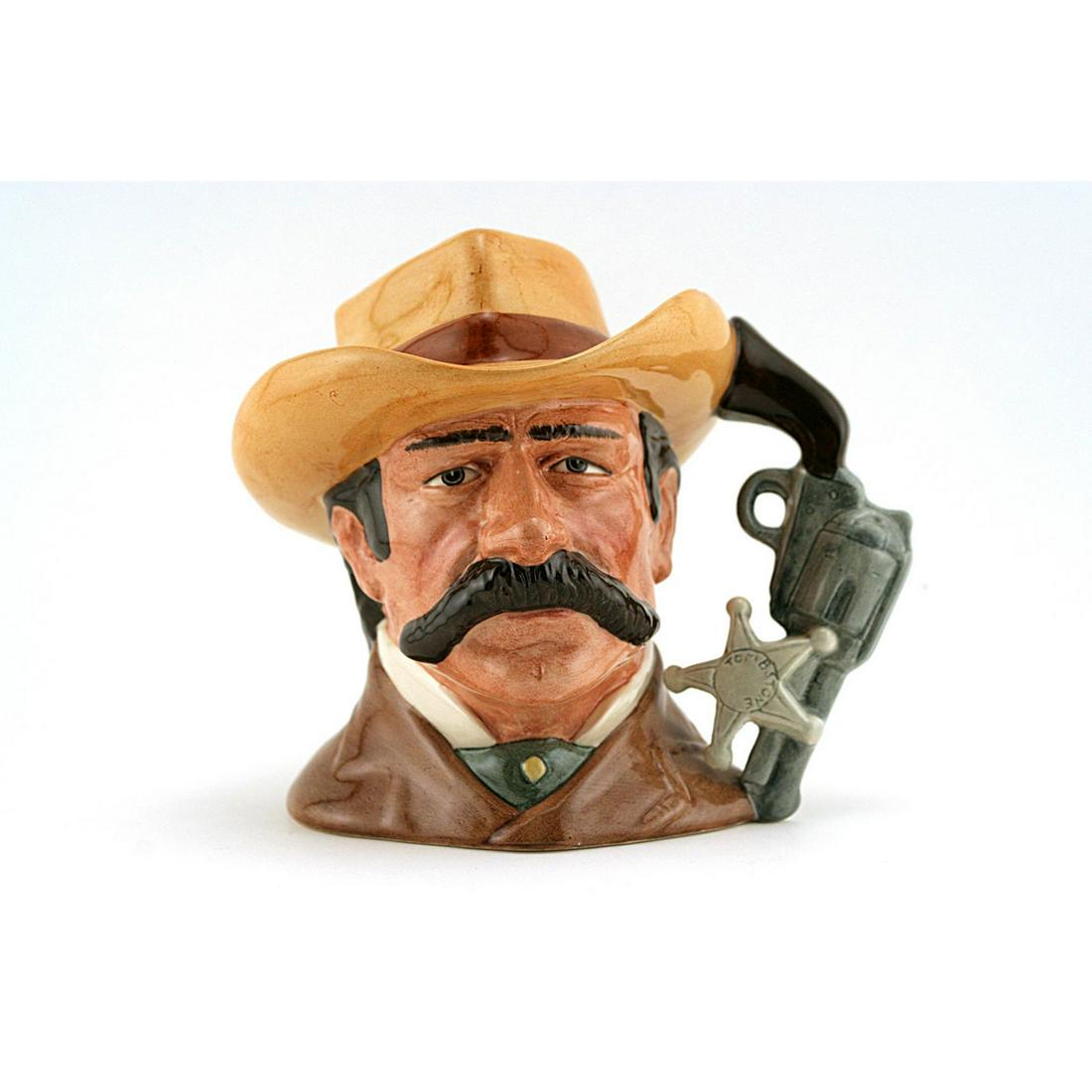 Wyatt Earp D6711 - Odd Size - Royal Doulton Character: Royal Doulton Character Jug, Wyatt Earp D6711 (brown coat; light brown hat with red band). Designed by Stanley J. Taylor. Series: The Wild West Collection, issued 1985 - 1989. Size: 5.5"H (odd)Wyatt B