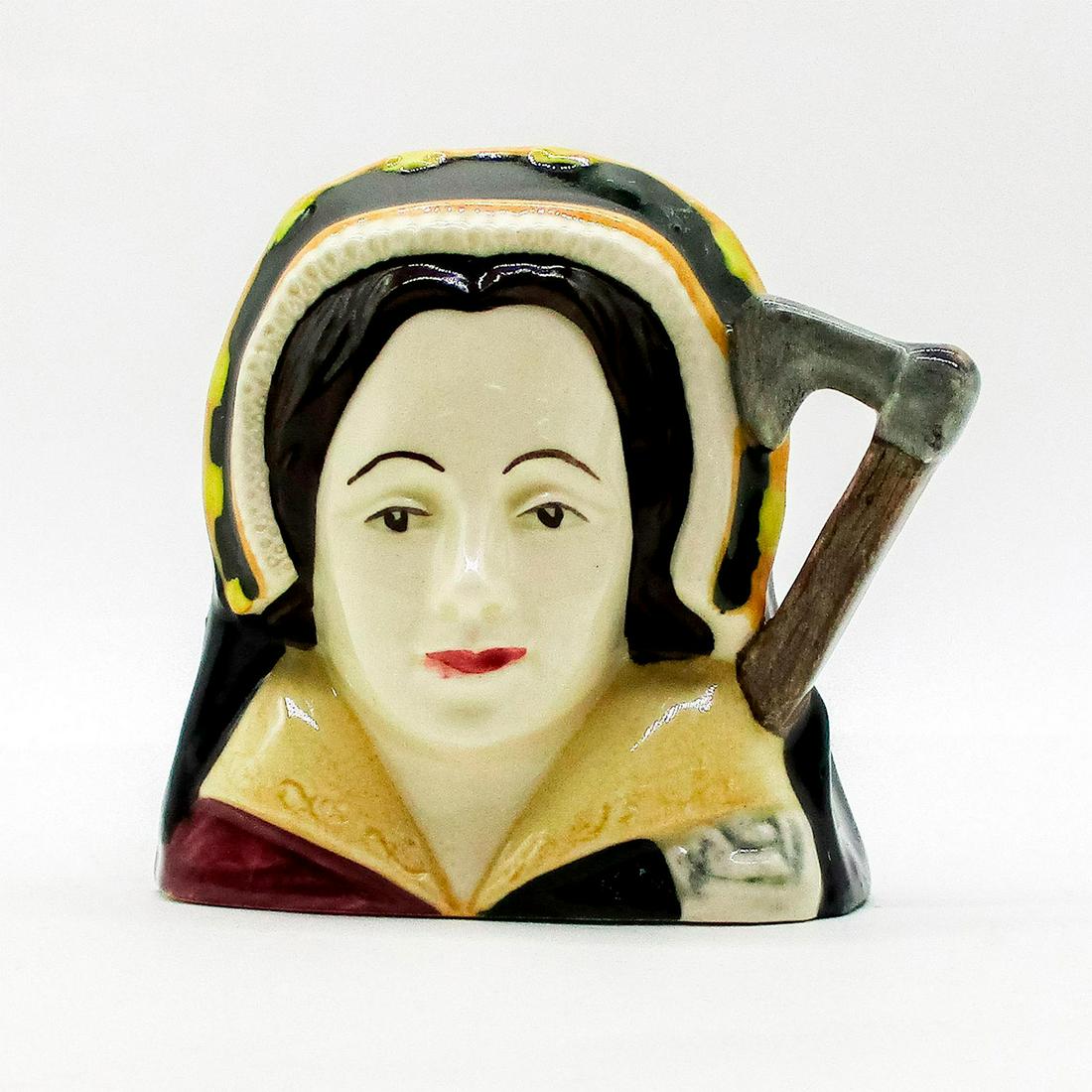 Catherine Howard D6693 - Mini - Royal Doulton Character: Style One. Brown, gold, and white coloration. Niece to the Duke of Norfolk, Catherine Howard (1521 - 1542) became Henry VIII's fifth wife on July 28, 1540, in a marriage arranged by her family. In 154