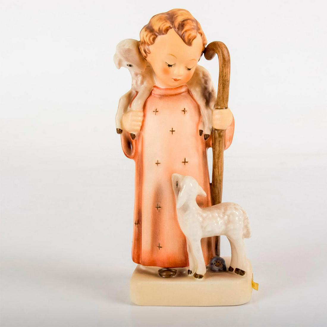 Good Shepherd 42 - Goebel Hummel Figurine: Matte porcelain, hand painted. Young girl in red robe standing with two lambs. 'M. I. Hummel' inscribed on base. Goebel backstamp. Age related crazing. Weight: 7.4 oz #goebel #hummel #figurine