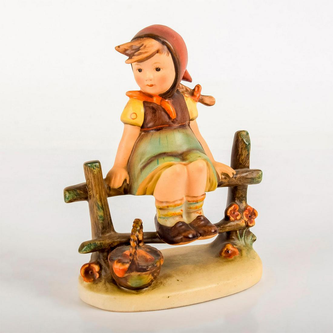 Just Resting 1121 - Goebel Hummel Figurine: Matte porcelain, hand painted. Young girl resting on a wooden fence with a basket by her side. 'M. I. Hummel' inscribed on base. Goebel backstamp. Good condition. #goebel #hummel #figurine Art
