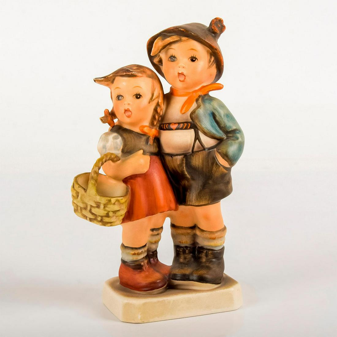 Surprise 941 - Goebel Hummel Figurine: Matte porcelain, hand painted. Young boy and girl, possibly siblings, standing close to one another. 'M. I. Hummel' inscribed on base. Goebel backstamp. Age related wear. Weight: 5.3 oz #goebe