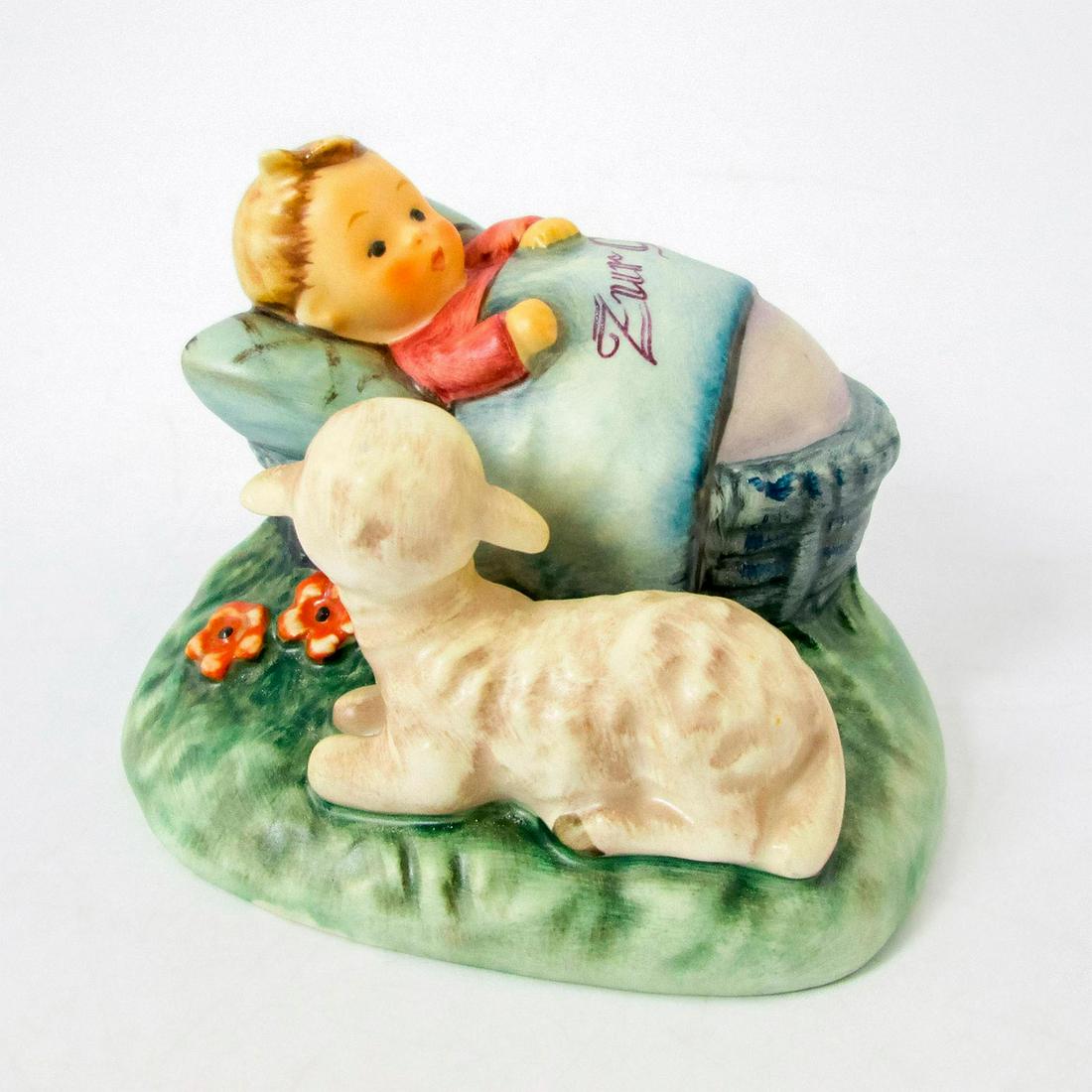 The Guardian 455 - Goebel Hummel Figurine: Matte porcelain, hand painted. Lamb watching over a baby in a basket. Blanket reads 'Zur Geburt,' or 'For Birth.' 'M. I. Hummel' inscribed on base. Goebel backstamp. Good condi