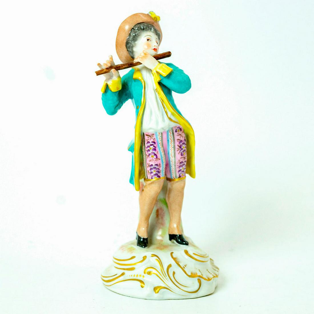 Arnart Creation Style Figurine, Flutist: Man playing flute. Hand painted glazed porcelain; finely painted details; gilt accents. Crossed arrows backstamp. Chipped hat and flute. Dimensions: 7.25"H Issued: 20th c.
