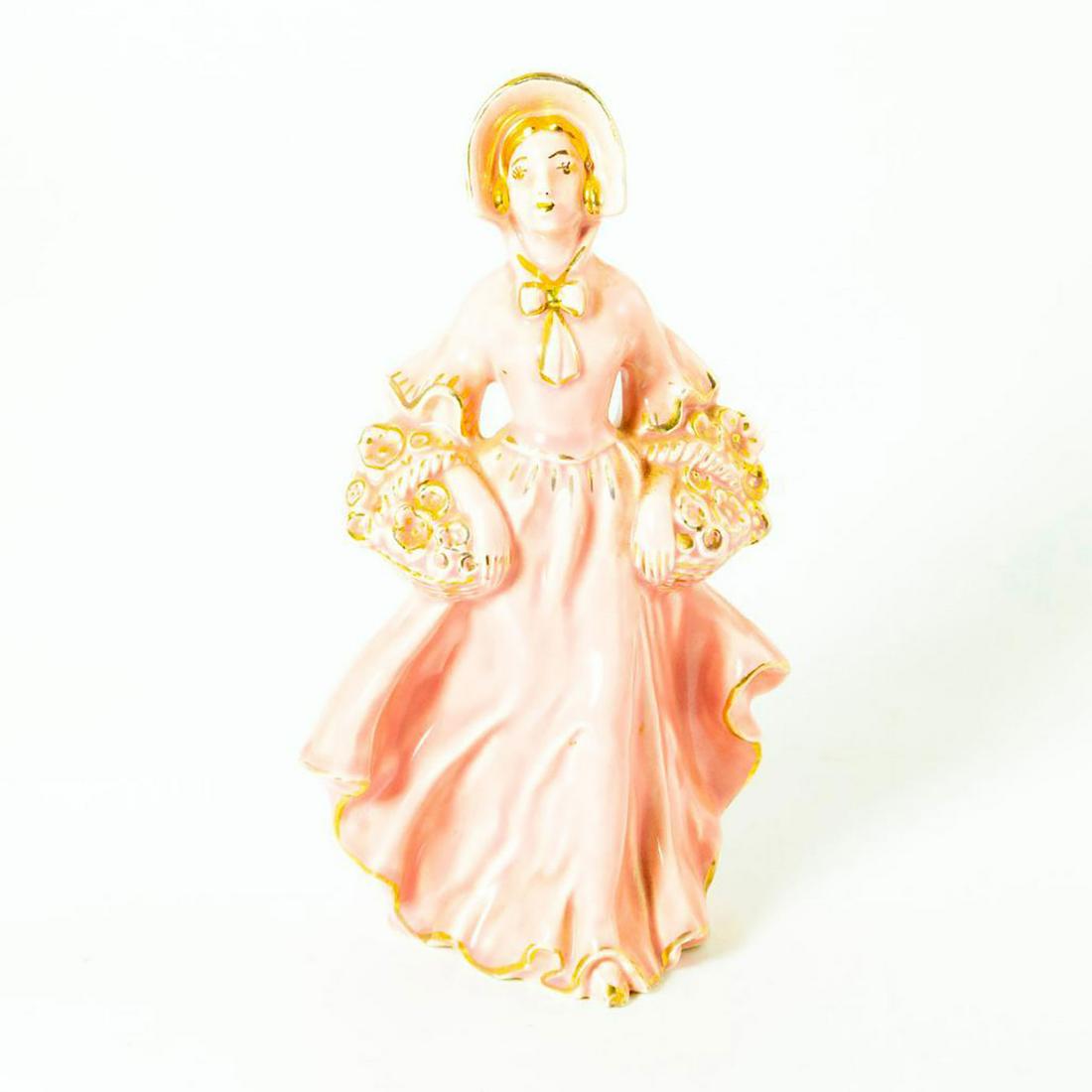 Vintage Japanese Style Porcelain Figurine Flower Lady: Glossy porcelain figurine; Pink glaze finish with gilt accents, Dimensions: 7.5"H Issued: 19th c. Country of Origin: Japan