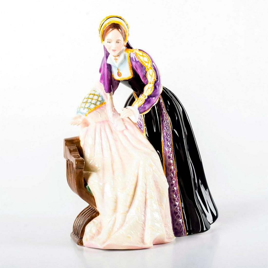 Catherine Howard HN3449 - Royal Doulton Figurine: Glossy finish, highly-detailed. Modeled as Queen of England, fifth wife of King Henry VIII and cousin of Anne Boleyn. Catherine is dressed in her highly detailed royal garments in black, purple, and g