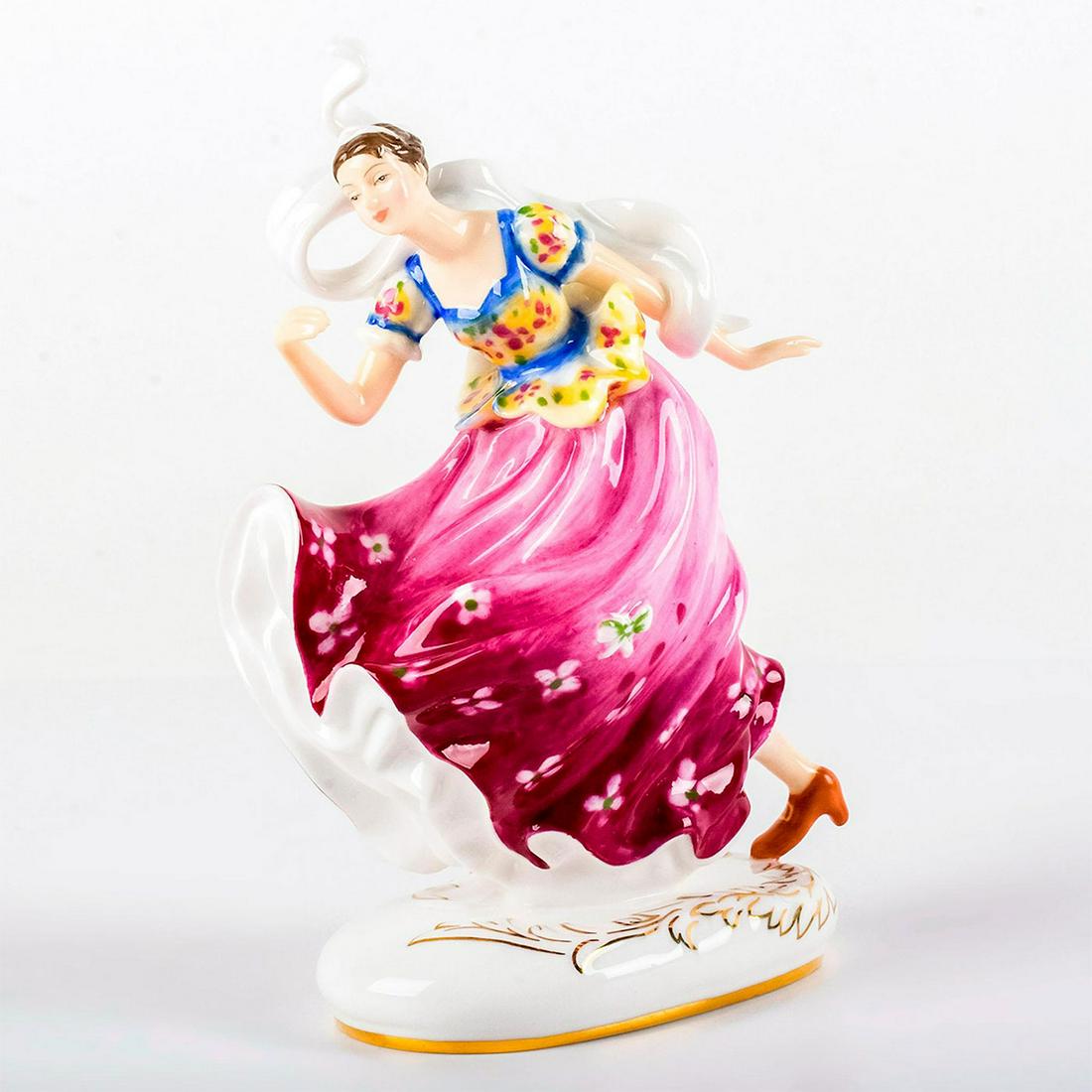 Columbine HN5654 - Royal Doulton Figurine: She wears a pink skirt, yellow patterned top, with a white scarf flowing behind her. Series: HN Icons. Royal Doulton backstamp. Limited edition number 537 of 2500 pieces. Artist: Leslie Harradine Issu
