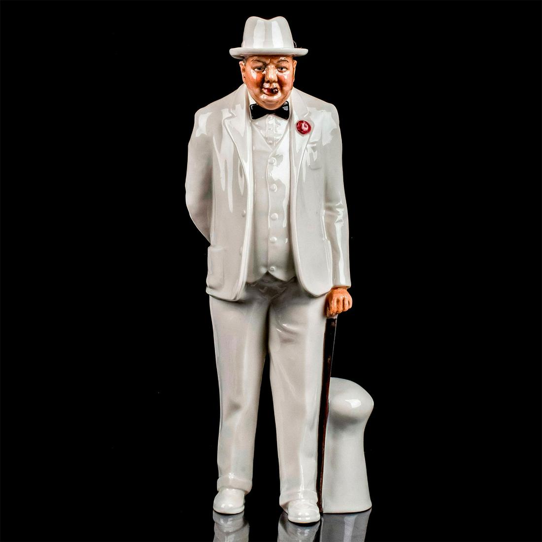 Royal Doulton Figurine, Sir Winston Churchill HN3057: Churchill in all white suit with black bow tie and cane in his hand. Glazed finish. Royal Doulton backstamp. #churchill #bowtie #classic Artist: Amanda Hughes Issued: 1985-2009 Dimensions: 10.5"H Manu
