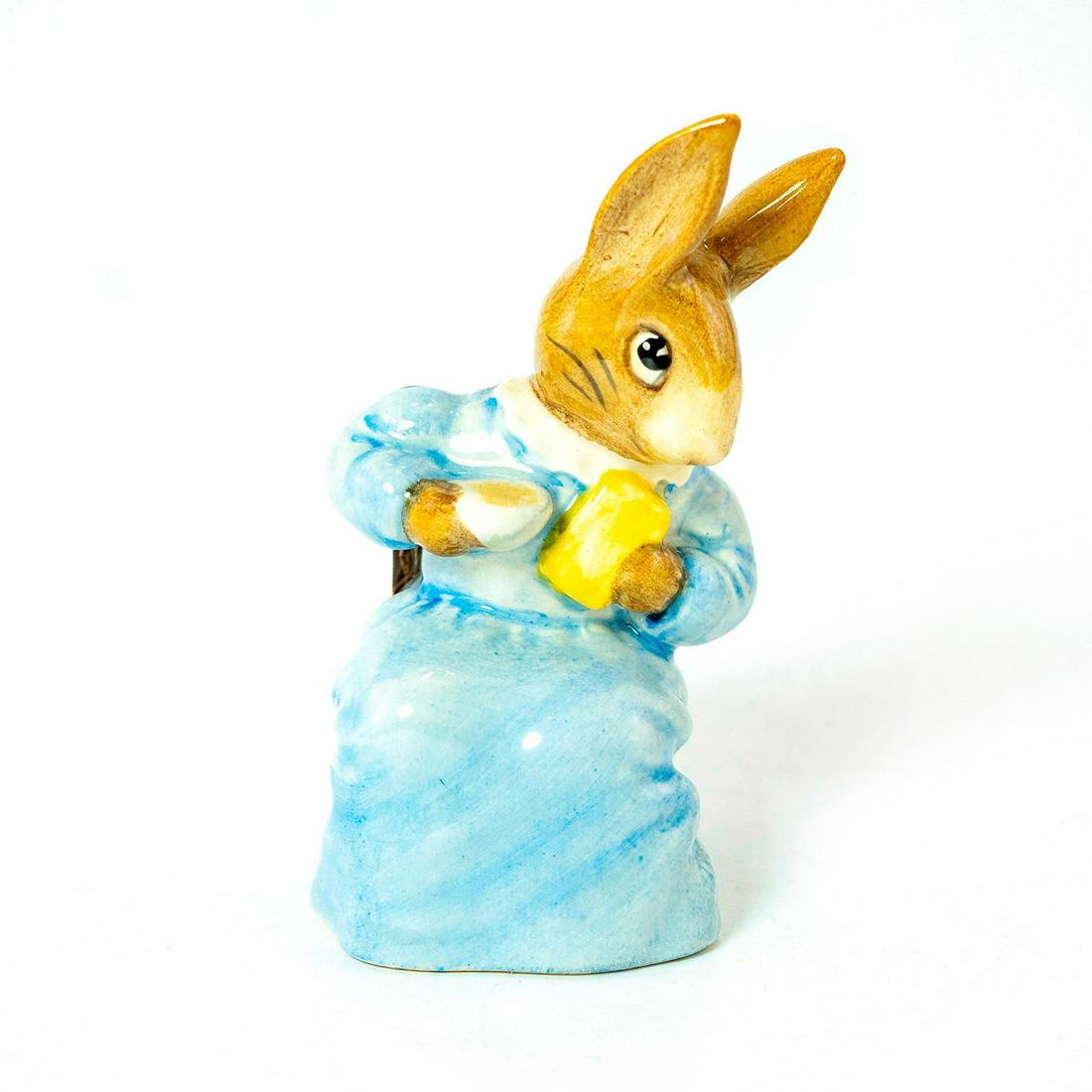 Cottontail - Beswick - Beatrix Potter Figurine: Beswick Backstamp. Blue dress, brown chair. Artist: David Lyttleton Issued: 1985 - 1996 Dimensions: 3.75''H Manufacturer: Beswick Country of Origin: England