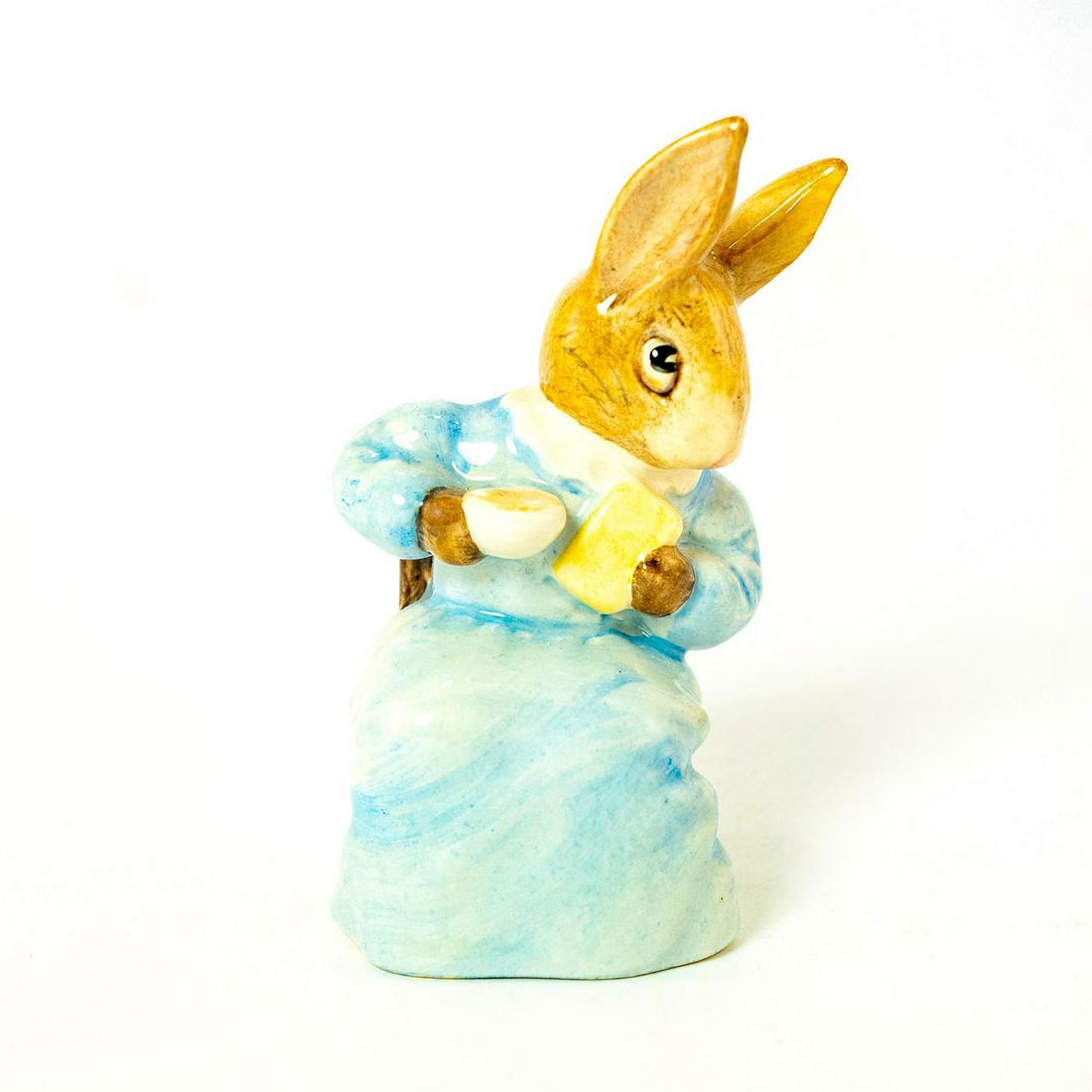 Cottontail - Beswick - Beatrix Potter Figurine: Beswick Backstamp. Blue dress, brown chair. Artist: David Lyttleton Issued: 1985 - 1996 Dimensions: 3.75''H Manufacturer: Beswick Country of Origin: England