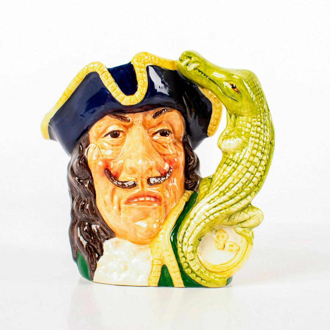 Capt Hook Old D6601 - Small - Royal Doulton Character: Style One, crocodile and clock handle. Blue tricorn trimmed with yellow; green coat trimmed with yellow; white ruffles at the neck. Royal Doulton backstamp. Artist: Max Henk and David B. Biggs Issued: