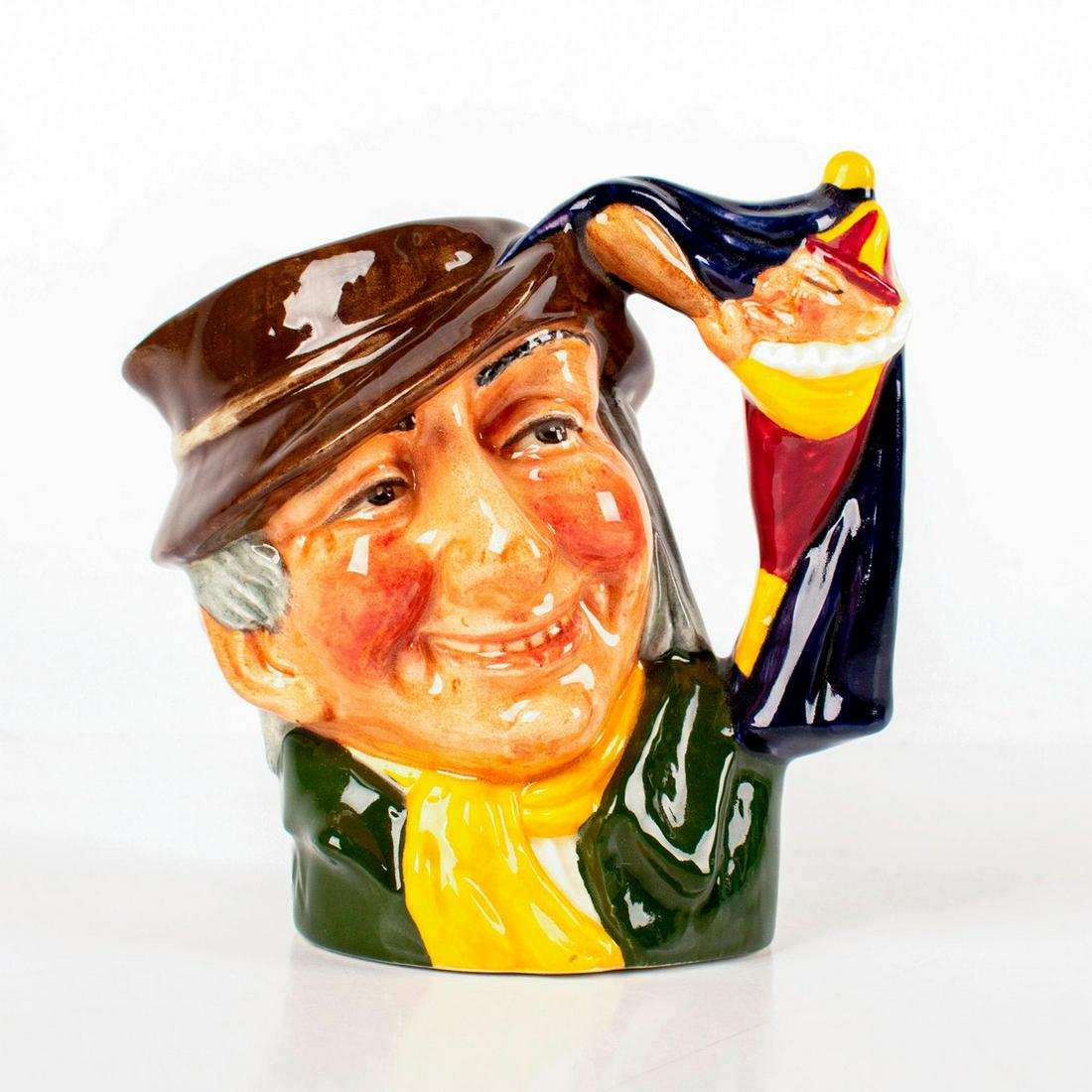 Punch and Judy Man D6593 - Small - Royal Doulton: Brown hat; green coat; yellow scarf. Royal Doulton backstamp. Artist: David B. Biggs Issued: 1964 - 1969 Dimensions: 3.5"H Manufacturer: Royal Doulton Country of Origin: England
