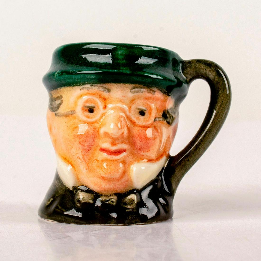 Mr. Pickwick D6260 - Tiny - Royal Doulton Character Jug: Style One, plain handle. Green hat and coat; maroon bow tie. Royal Doulton backstamp. Artist: Leslie Herradine and Harry Fenton Issued: 1947 - 1960 Dimensions: 1.25"H Manufacturer: Royal Doulton Count