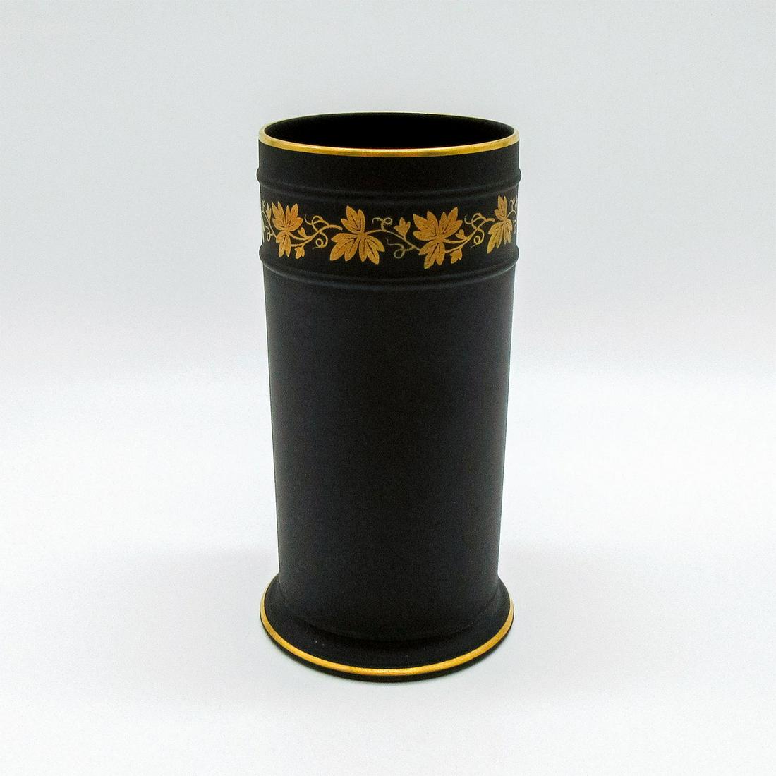 Wedgwood Black Basalt Gilded Spill Vase: Black basalt spill vase with 22k gold gilded leaf pattern around upper body and trim. Impressed Wedgwood backstamp. Weight: 6.4 oz #wedgwood #blackbasalt #basalt Issued: 2001 Dimensions: 5.25"H x 2.75