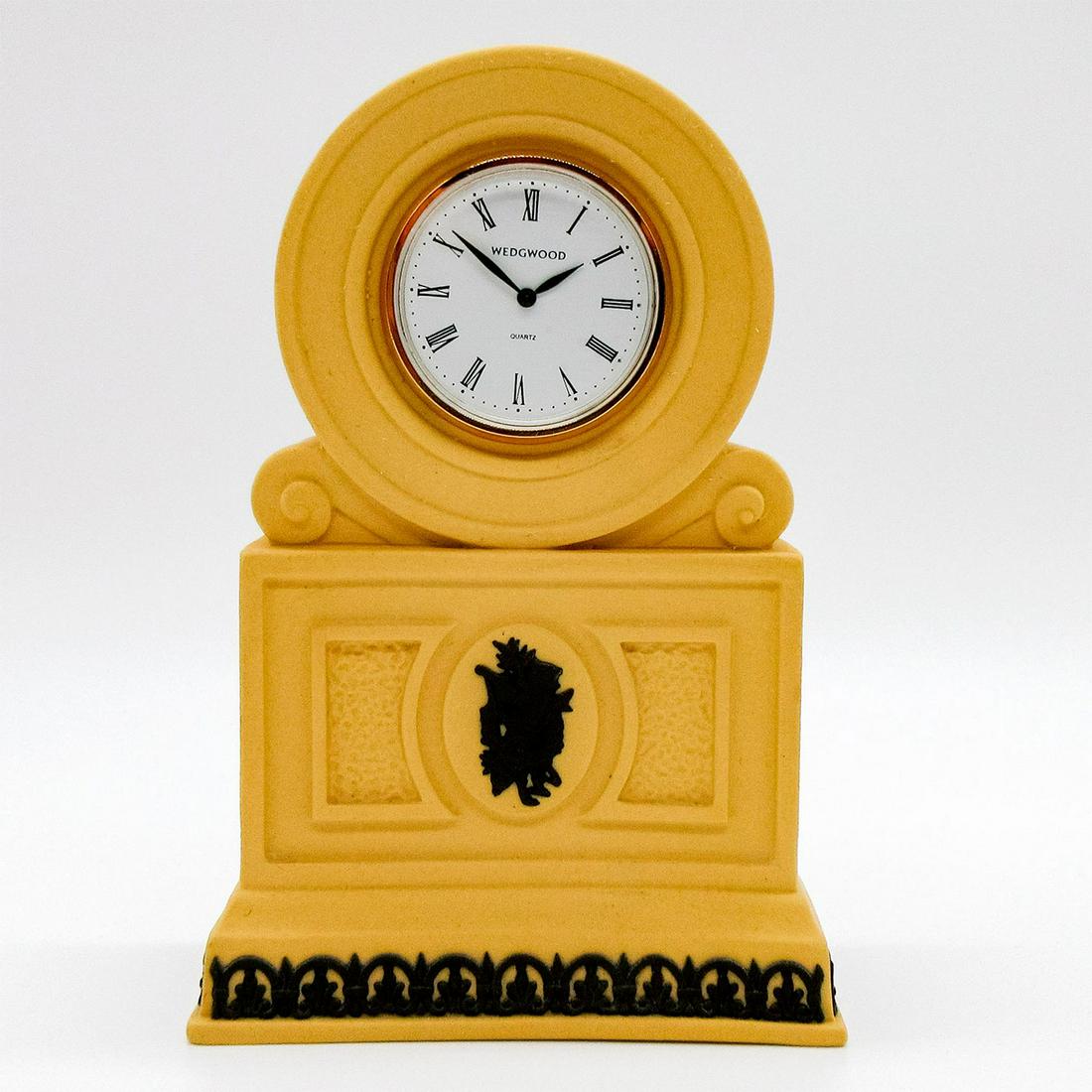 Wedgwood Yellow Cane Jasperware Troy Clock: Jasperware clock with yellow cane ground with Neoclassical Olympus design in black relief. From the Library Collection. Impressed Wedgwood backstamp. Clock untested. Weight: 8.6 oz #wedgwood #jasperwa