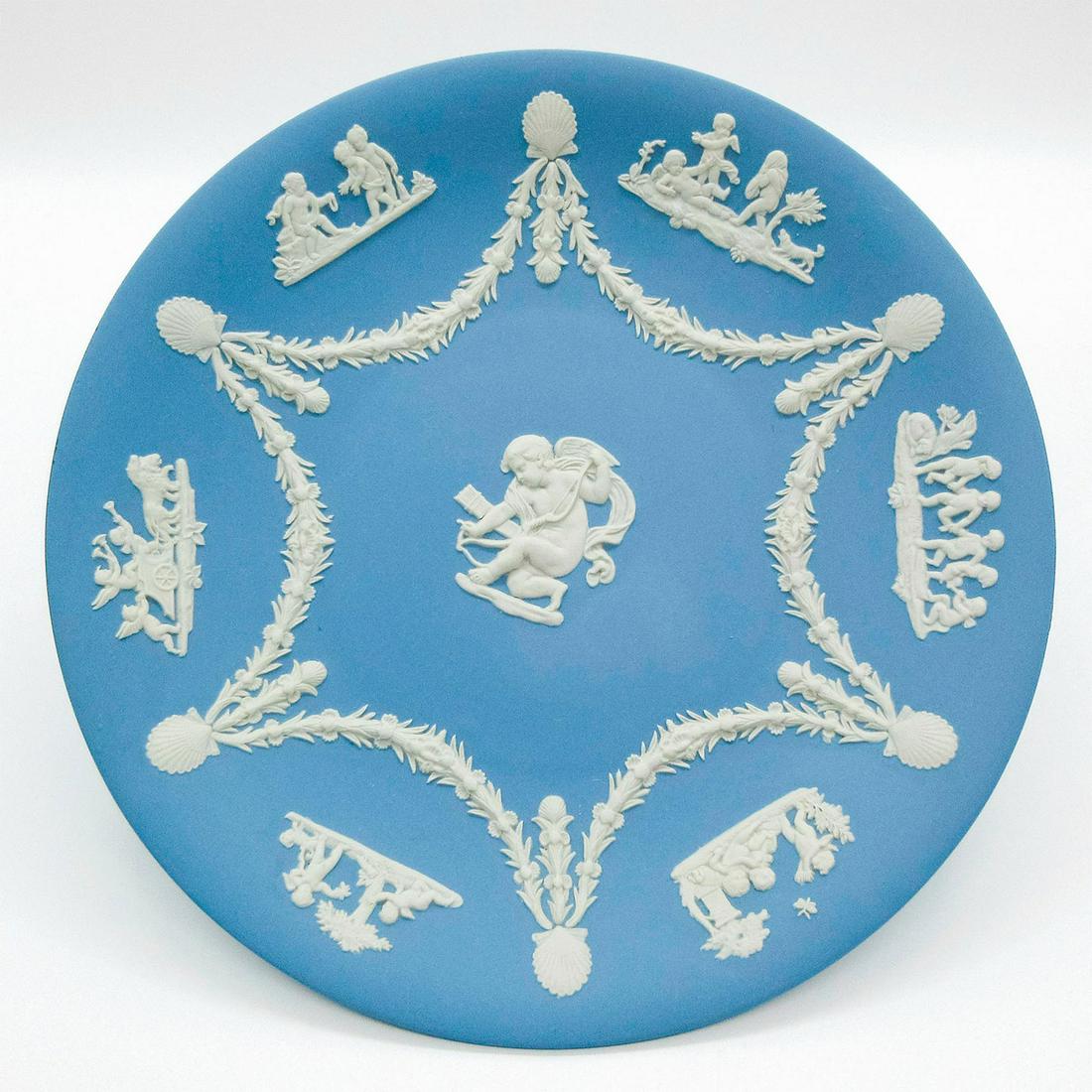Wedgwood Pale Blue Jasperware, Cherub Decorative Plate: Pale blue jasperware plate with cherub and seashell garlands design sprigged decorations. Wedgwood impressed on the back. Weight - 15.7 oz. Minor age related wares. Overall good condition. Weight: 15.