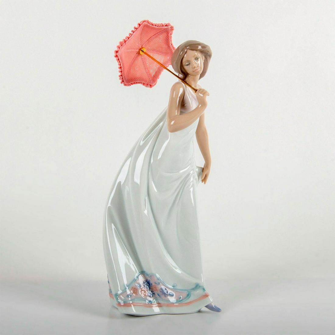 Lladro Porcelain Figurine, Afternoon Promenade 1007636: Glossy finish; Lady holding a highly detailed parasol, going for a stroll. Lladro Society Piece 1995 backstamp. Original box included. Weight: 2 lbs 4.8 oz #lladro #porcelain Artist: Jose Puche Issued