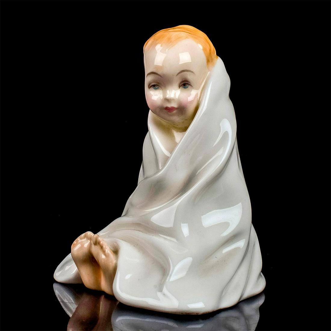 This Little Pig HN2125 - Royal Doulton Figurine: Harradine Child Classic series. Modeled as a child with ten little piggies peaking out from under a white blankie. Royal Doulton backstamp. Artist: Leslie Harradine Issued: 1984 - 1995 Dimensions: 4"H