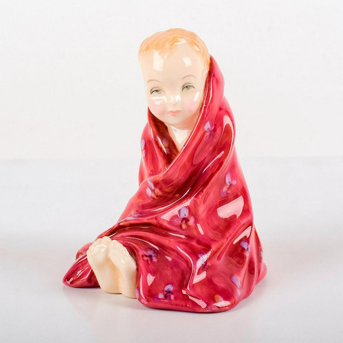 This Little Pig HN1793 (red) - Royal Doulton Figurine: Harradine Child Classic series. Modeled as a child with ten little piggies peaking out from under a red floral blankie. Royal Doulton backstamp. Artist: Leslie Harradine Issued: 1936 - 1995 Dimensions