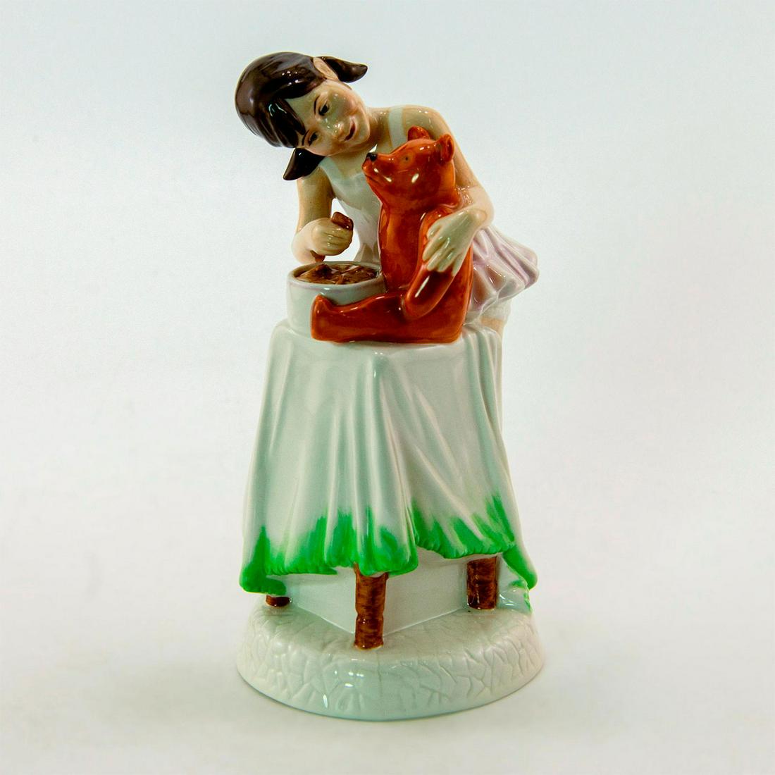 And One For You HN2970 - Royal Doulton Figurine: A young girl shares her cookies with her favorite teddy bear. Series: Childhood Days. Royal Doulton backstamp. Artist: Amanda Hughes Issued: 1982 - 1985 Dimensions: 6.5"H Manufacturer: Royal Doulton C