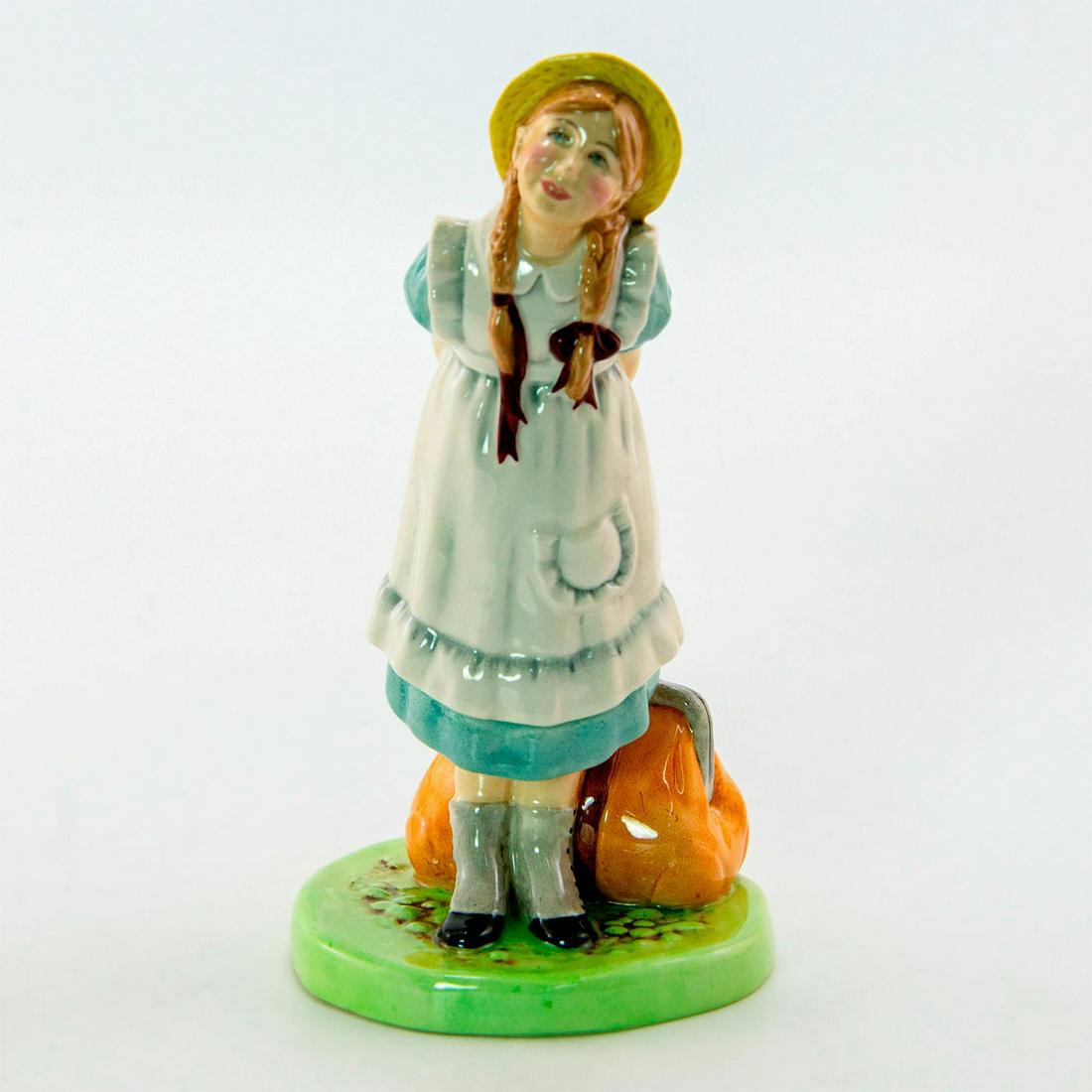 Pollyanna HN2965 - Royal Doulton Figurine: Modeled after a character from an Eleanor H. Porter novel, wearing a blue and white dress and yellow hat. Series: Children's Literature. Royal Doulton backstamp. Artist: Pauline Parsons Issued: 1982 -