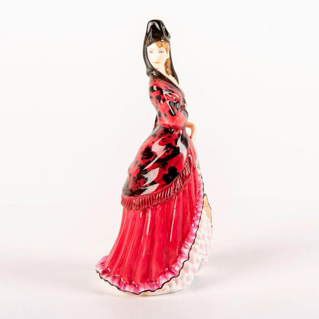 Mantilla HN5653 - Royal Doulton Figurine: Bone China. She wears a red dress with a black and red floral mantilla (shawl). Series: HN Icons. Royal Doulton backstamp. Limited edition number 537 of 2500. Artist: Peter Gee Issued: 2013 Dimensions