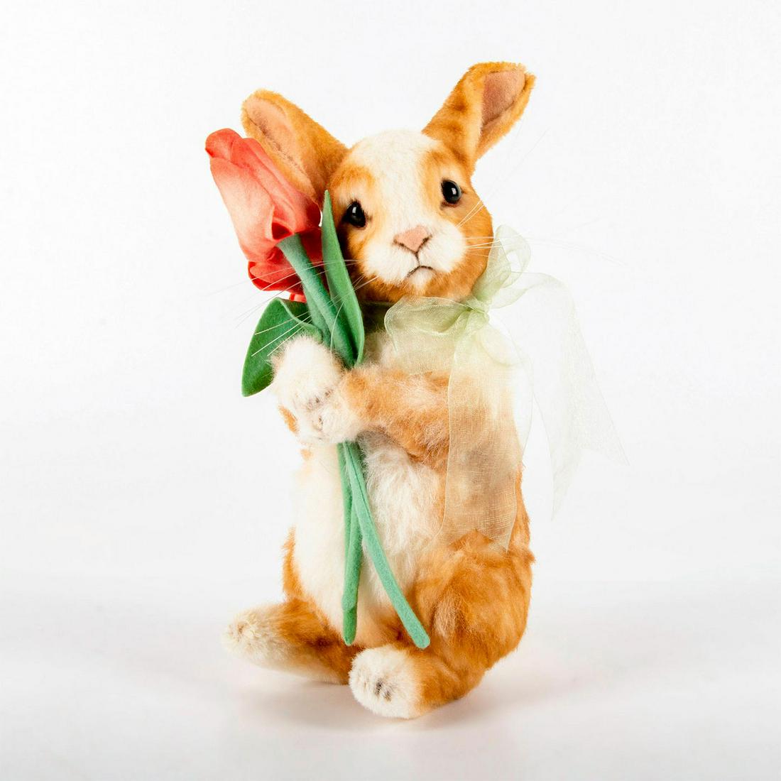 R. John Wright Bunny Doll, Tulip: Alpaca plush bunny with felt details, jointed head, and German glass eyes. Wears an organdy bow and holds bouquet of tulips. Limited edition number 41 of 250 pieces. Original box and certificate of au