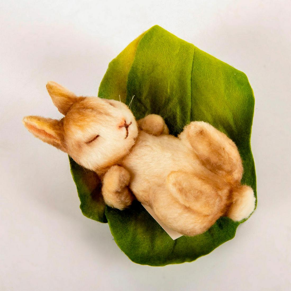 R. John Wright Doll, Beatrix Potter, Flopsy Bunny: Fully jointed mohair bunny with embroidered features. Nestled in a leaf of molded felt lettuce. Limited edition number 48 of 350 pieces. Original box and certificate of authenticity included. From the