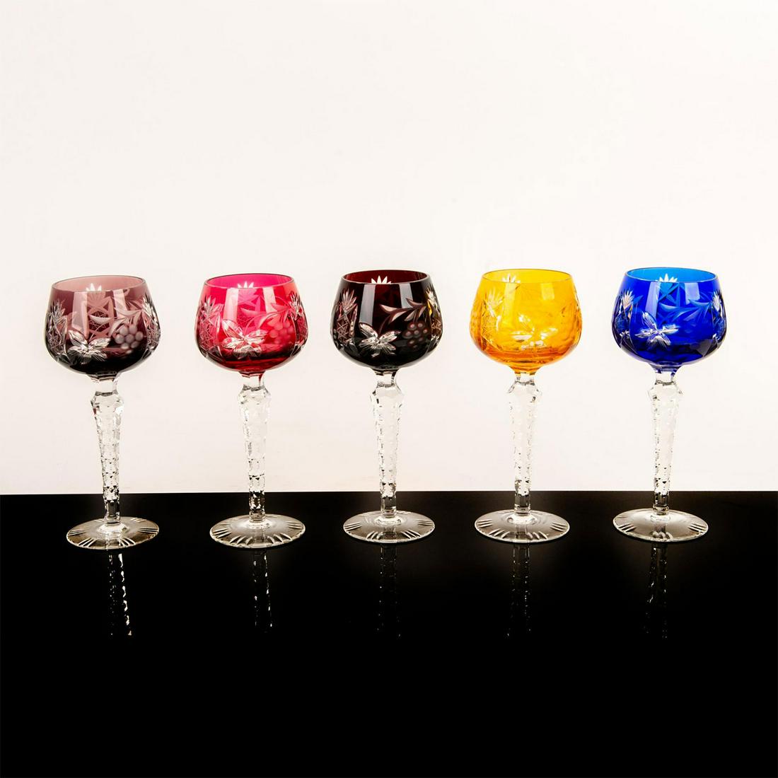 Set of 5 Colored Crystal Wine Goblets, Grapes and: Nachtmann style color overlay cut to clear hock wine glasses. Beautiful color assortment of sapphire, garnet, amethyst, topaz and burgundy. Design features flowers, grapes, leaves and starbursts with 