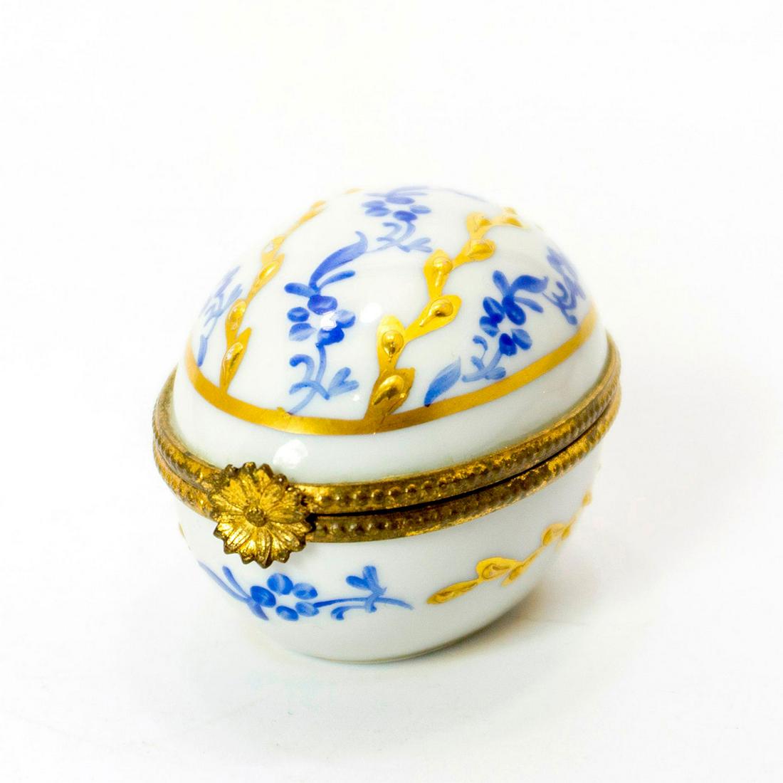 Limoges Trinket Box, Blue and Gold: Glazed; Gorgeous blue, white and gold box. Limoges backstamp. Handwritten: Paris Stella Issued: 19th c. Dimensions: 3"L Manufacturer: Limoges Country of Origin: France