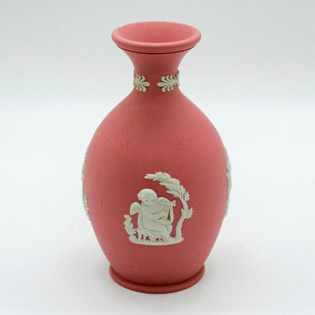 Wedgwood Pink Jasperware Bud Vase: Floral pattern and Grecian inspired decorations, both in cream colored relief. Wedgwood impressed into base. Good condition. #wedgwood #jasperware #pink #vase Dimensions: 4.75"H Issued: 20th c. Manufa