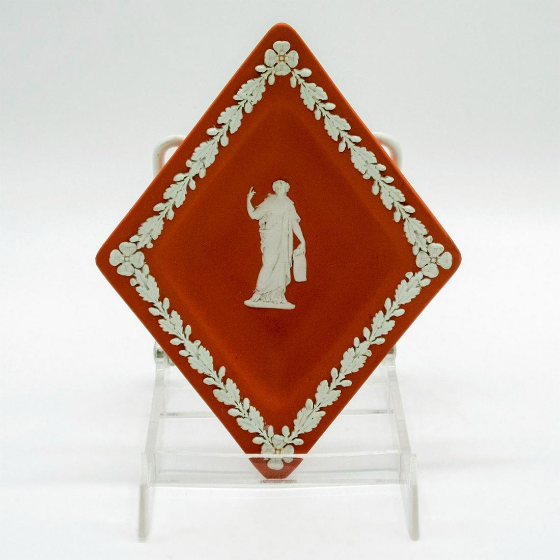 Wedgwood Terracotta Jasperware Diamond Ashtray: Floral pattern on rim in cream colored relief; Grecian inspired figure in center of tray. Wedgwood impressed on base. Good condition. #wedgwood #jasperware #ashtray #diamond Dimensions: 5.75"L x 4.5"W