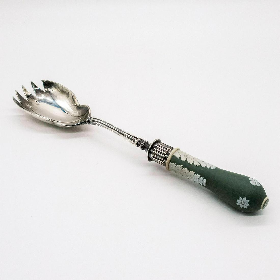 Wedgwood Sage Green Jasperware Serving Spoon: Cream colored decorations in relief along handle; silver plate neck and bowl. No visible Wedgwood marker. Age related wear. #wedgwood #jasperware #spoon Dimensions: 10.75"L Issued: 20th c. Manufacture