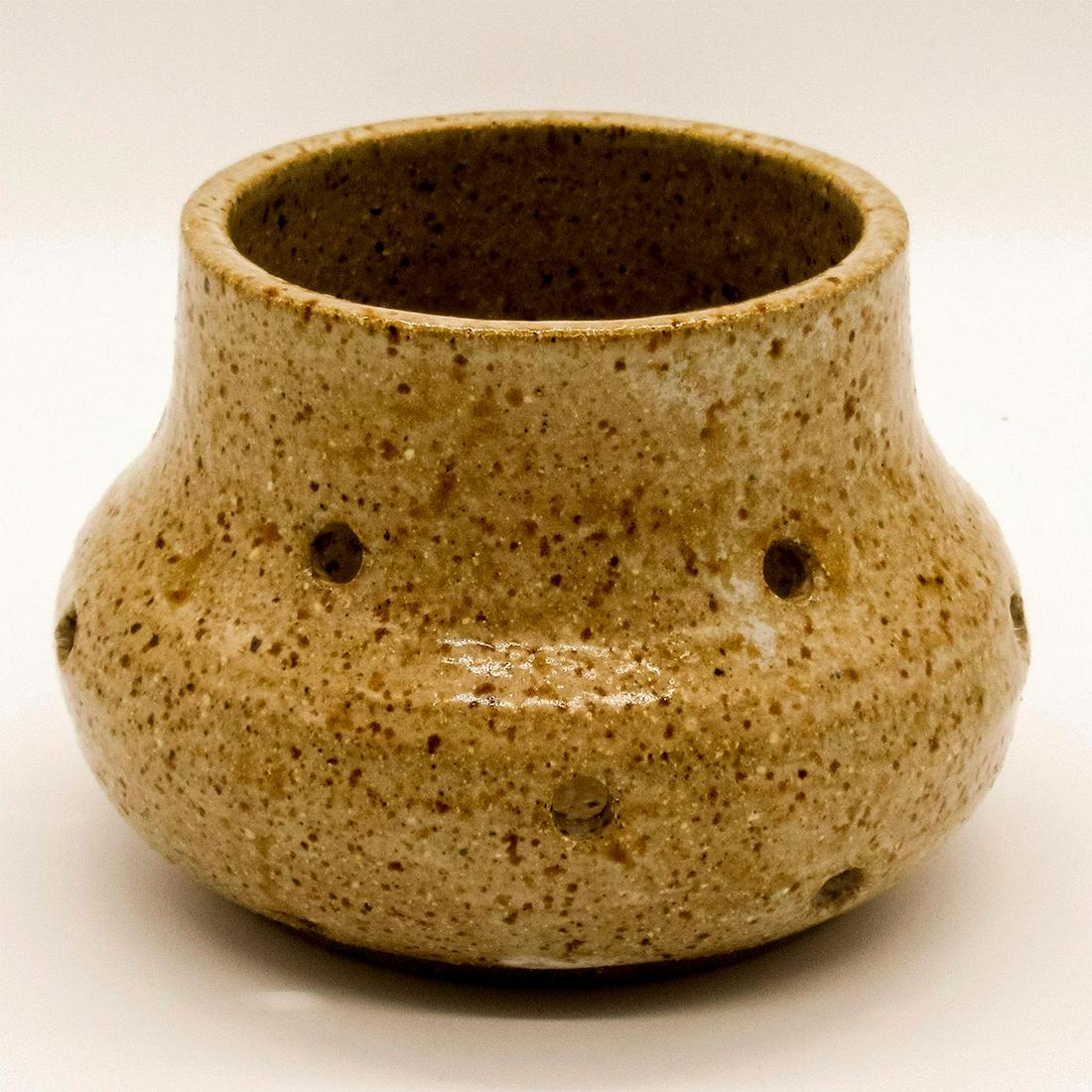 Signed Sue Ebbeson Pottery Candle Holder: Glazed finish; holes installed throughout to allow candlelight to escape. Artist signature on base. Good condition. #pottery #folkart #candle #jar Issued: 20th - 21st c. Artist: Sue Ebbeson Country of