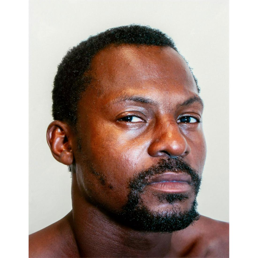 Tim O. Walker (American) Signed, Photograph, Jessie: Archival Ultrachrome ink on paper with white matte. Portrait of a man with a serious expression. Signed lower right, pencil. Titled and numbered I of VI lower left, pencil. From the portfolio Look at 