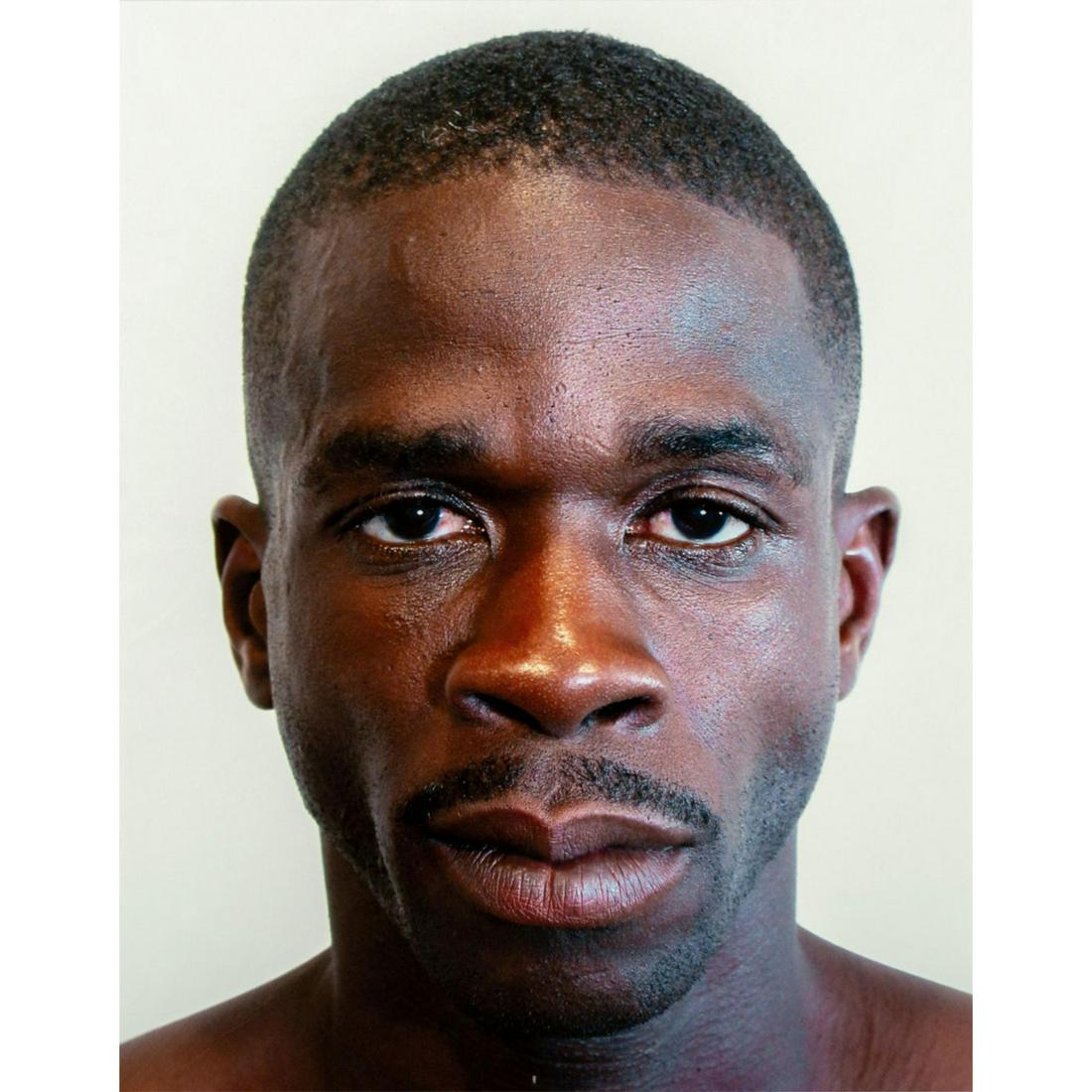 Tim O. Walker (American) Signed, Photograph, Berry: Archival Ultrachrome ink on paper with white matte. Portrait of a man with a serious expression. Signed lower right, pencil. Titled and numbered I of VI lower left, pencil. From the portfolio Look at 