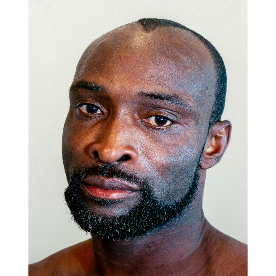 Tim O. Walker (American) Signed, Photograph, Damian: Archival Ultrachrome ink on paper with white matte. Portrait of a man with a serious expression. Signed lower right, pencil. Titled and numbered I of VI lower left, pencil. From the portfolio Look at 