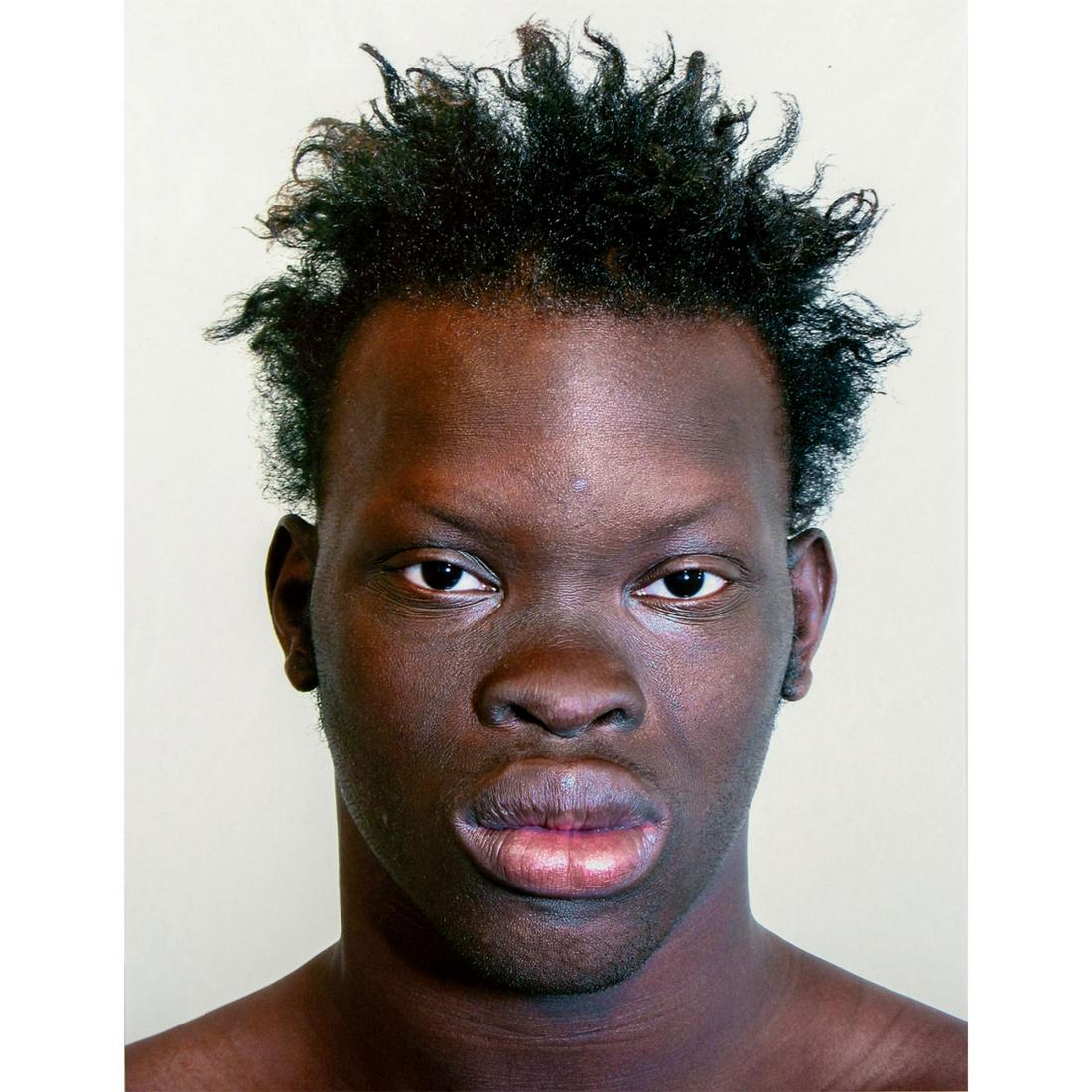 Tim O. Walker (American) Signed, Photograph, Marcellus: Archival Ultrachrome ink on paper with white matte. Portrait of a man with a serious expression. Signed lower right, pencil. Titled and numbered I of VI lower left, pencil. From the portfolio Look at 