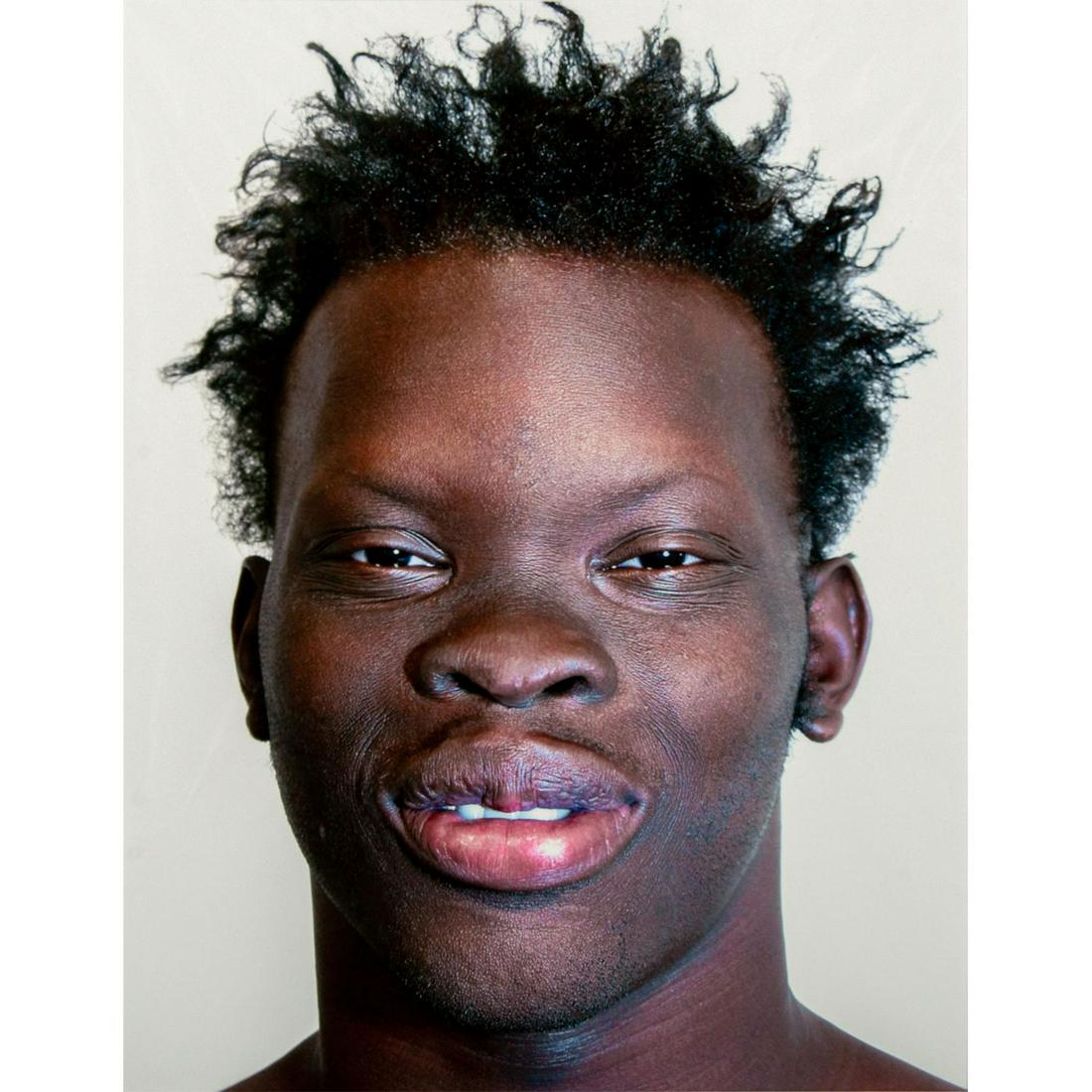 Tim O. Walker (American) Signed, Photograph, Marcellus: Archival Ultrachrome ink on paper with white matte. Portrait of a smiling man. Signed lower right, pencil. Titled and numbered I of VI lower left, pencil. From the portfolio Look at Me, is an ongoing 