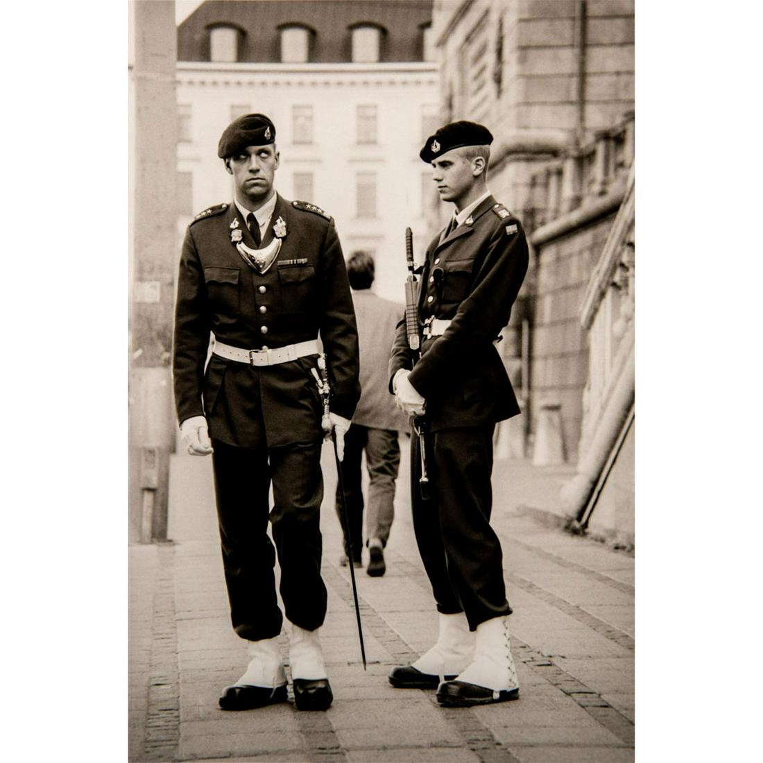 David Liu (American, b. Hong Kong 1958) Signed: Selenium toned silverprint; depicting two armed Swedish soldiers in uniform. Artist signed in pencil on verso. Unframed. Good condition. Dimensions: 14"H x 11"W (35.6cm x 27.9cm). (t.32.1999.002).#art