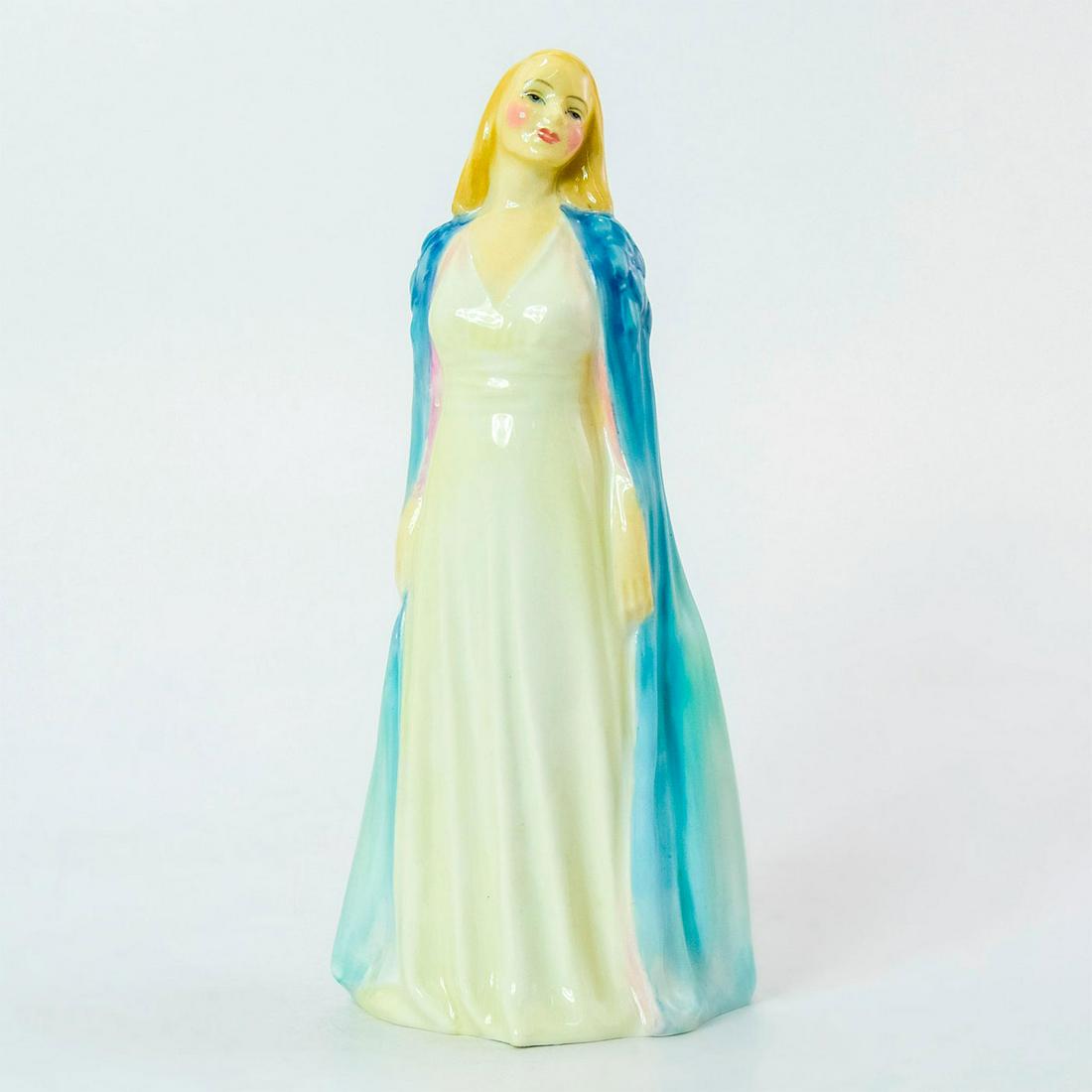 Collinette HN1998 - Royal Doulton Figurine: Hand-decorated Bone China. She wears a long white dress with a gradient blue cape. Series: Harradine Classics. Royal Doulton backstamp. Artist: Leslie Harradine Issued: 1946 - 1975 Dimensions: 6.25"H 