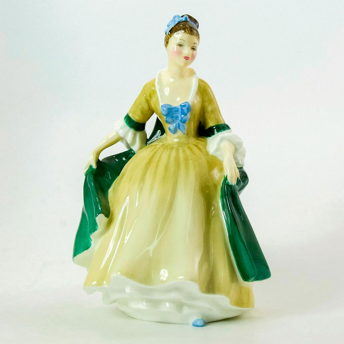 Elegance HN2264 - Royal Doulton Figurine: Bone China. Simply stunning a yellow dress and green cape, accented with blue bows. Series: Peggy Davies Classic. Royal Doulton backstamp. Artist: Peggy Davies Issued: 1961 - 1985 Dimensions: 7.25"H M